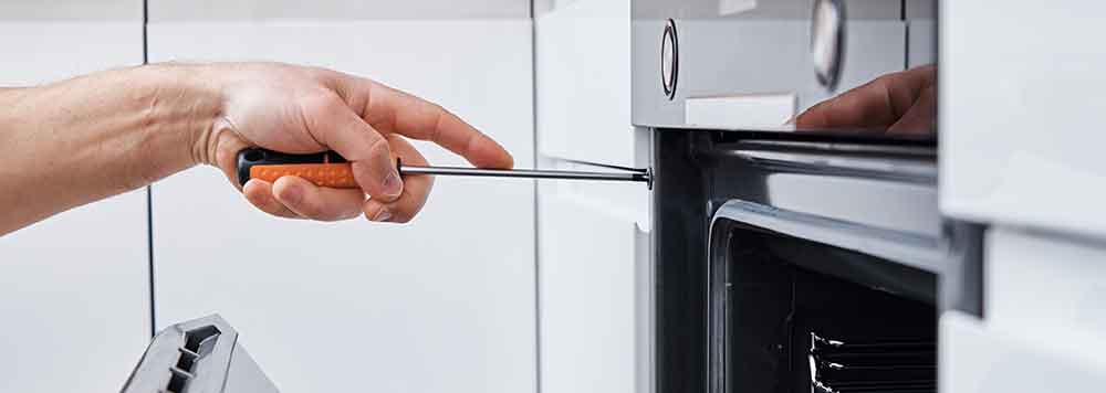 https://www.applianceprotoday.com/wp-content/uploads/sites/2/2022/09/working-on-oven.jpg